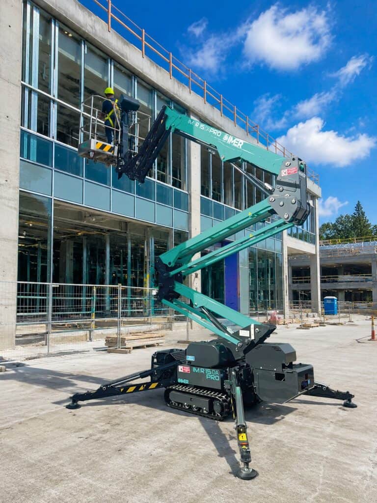 IM R 49 / 15 DA Pro tracked spider lift reaching the facade of a building under construction