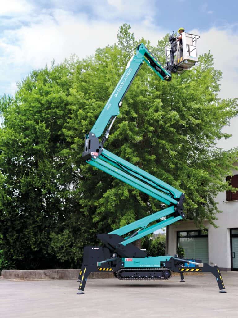 IM R 74 / 23 DA Pro tracked spider lift working on a villa facade among trees